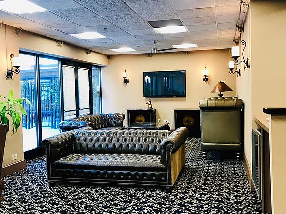 Common Room with pool table, television, and Library