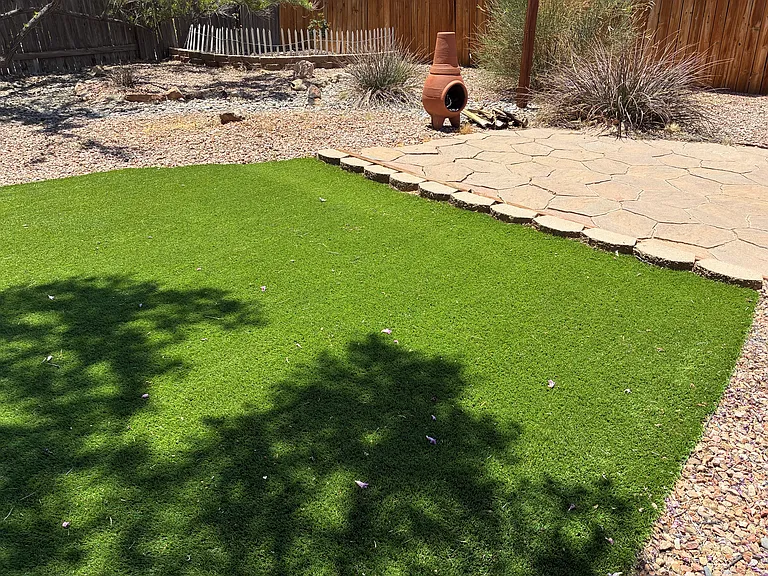 back yard, flower garden in the corner option, flagstone patio, wood burning patio chimenea
