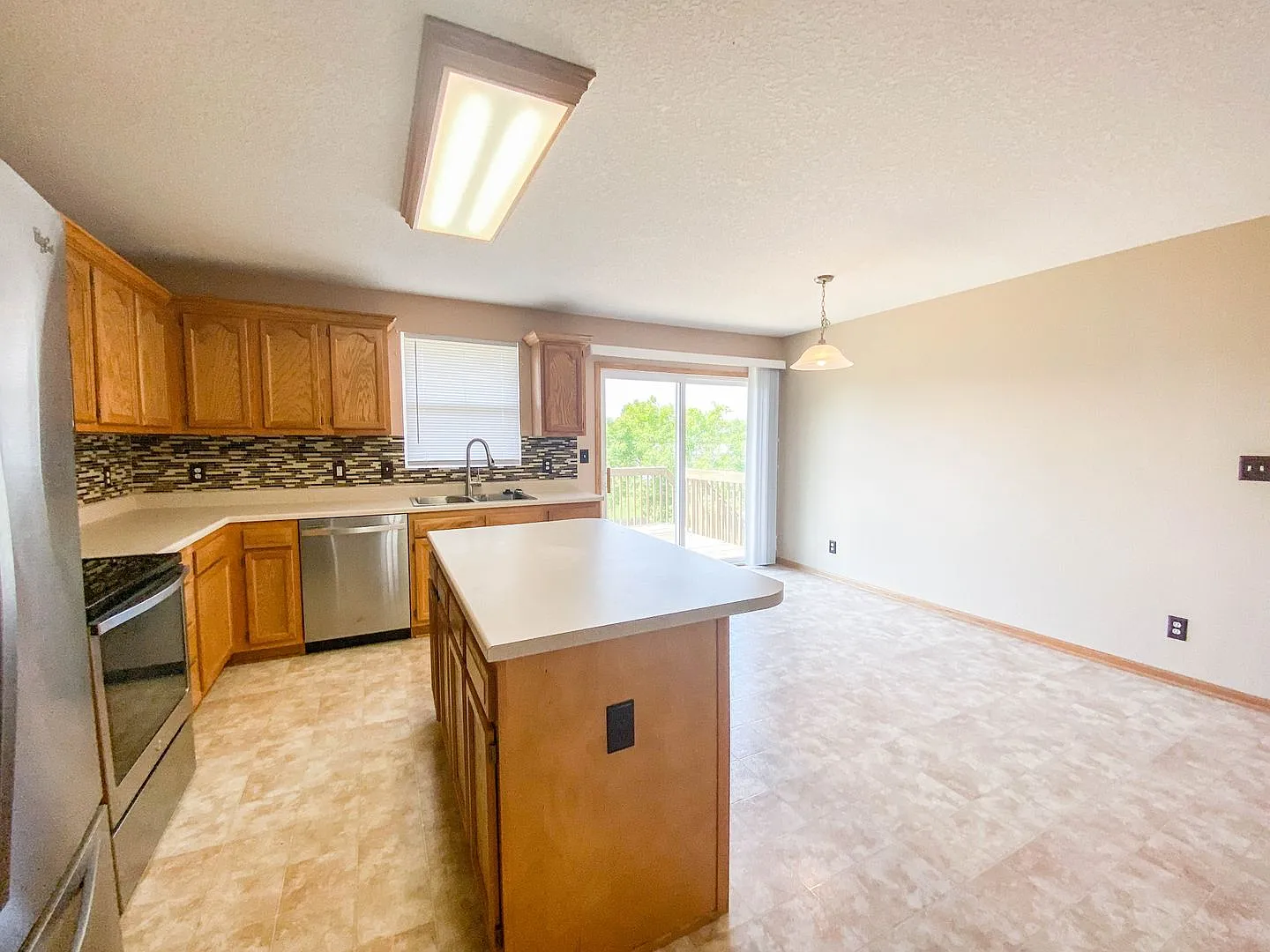 Spacious 3-Bedroom Waukee Home with Fenced Yard, Deck & 2-Car Garage — Photo 4