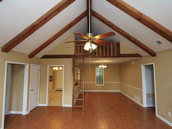 living room with attic space