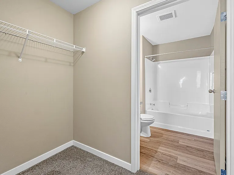 Elevate your living at Minot Place Apartments, featuring spacious closets and modern bathrooms. Enjoy stylish finishes and ample storage that enhance everyday comfort. Schedule a tour today to see your new home!
