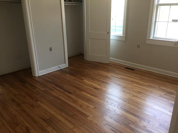 Large bedroom with 2 closets and hardwood floors