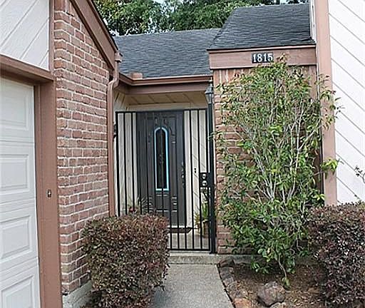 Pretty front walk welcomes you for a closer look. Front gate adds extra security & peace of mind.