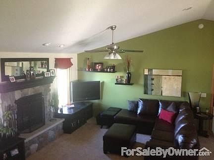 Living Area
						:
						Completely open plan with vaulted ceiling & large stone fireplace with hearth