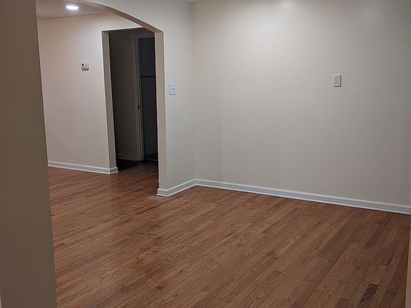 VIEW FROM BONUS ROOM TO FORMAL DINING ROOM AND DOOR TO BEDROOM / BATH HALLWAY