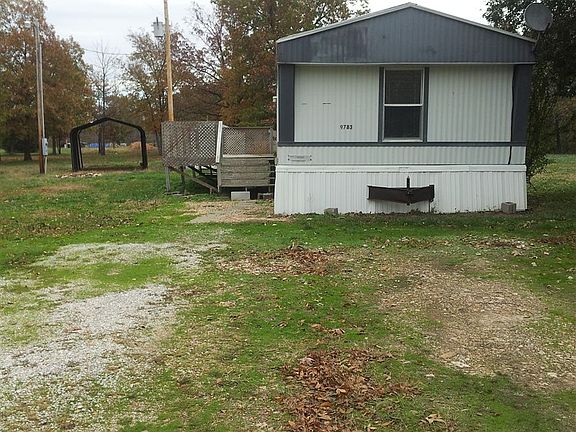Large yard, large storage shed and covered carport. 9783