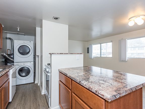 Washer/Dryer Stack next to Kitchen