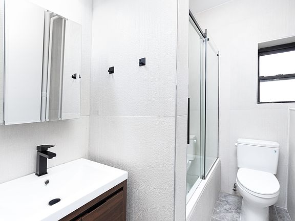 5th image of 247 E 10th St APT 4