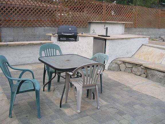 Backyard With Built-In BBQ, Firepit, and Refrigerator
