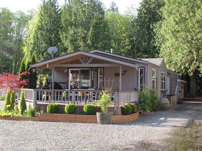 Covered porch & deck off front of home.