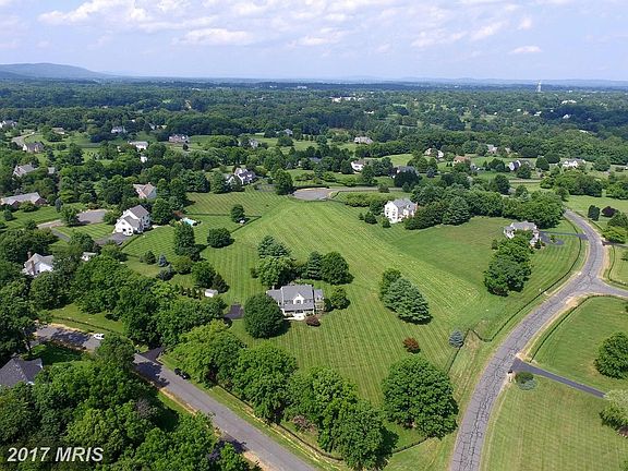 Prime Farmington lot borders open space meadow
