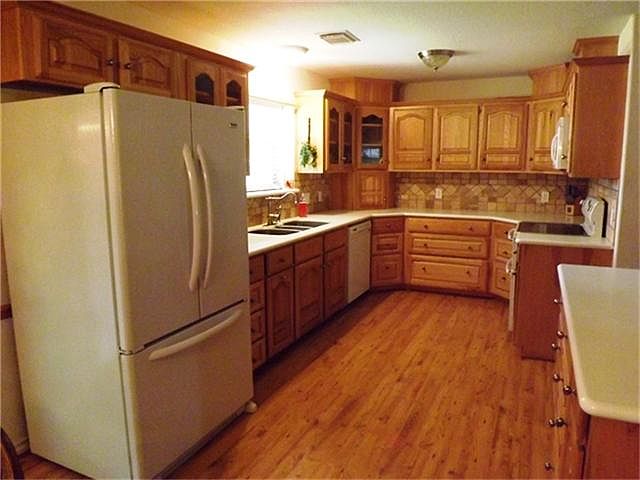 This home centers around this fabulous kitchen!  The floors and cabinets compliment each other.