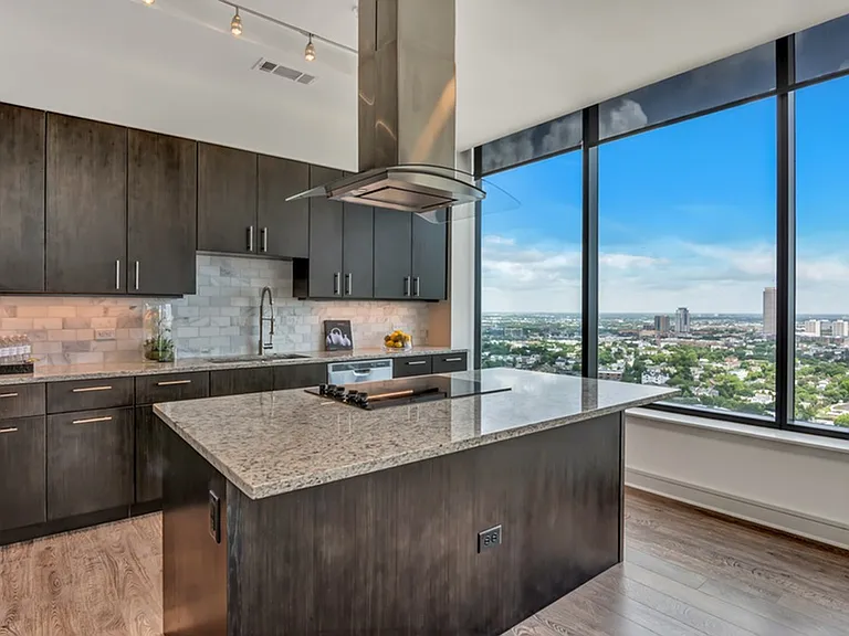 Chef-appointed kitchens featuring a suite of premium appliances and spacious kitchen islands