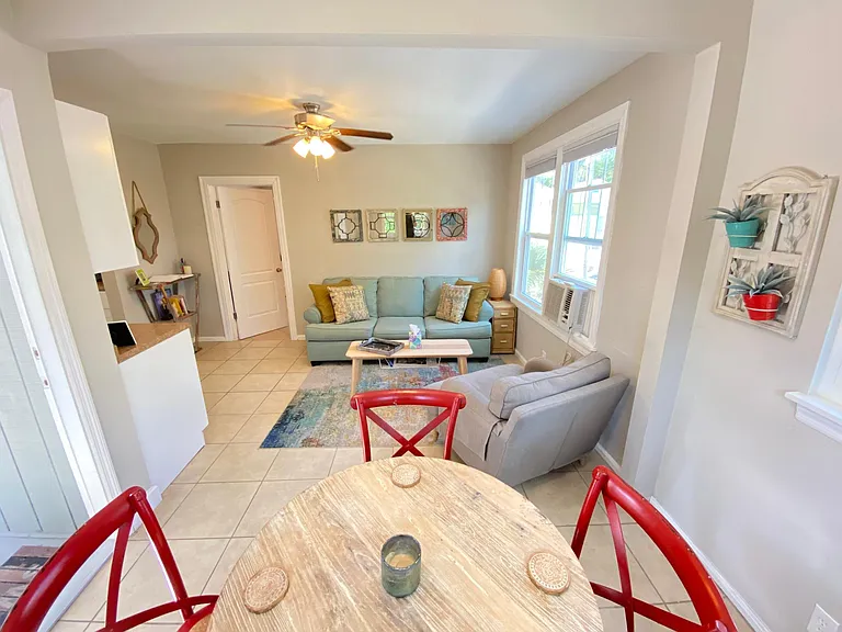 Looking from dining room right as you walk into it, door is on the left