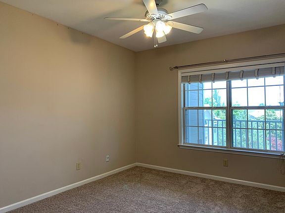 Master bedroom with window overlooking balcony
