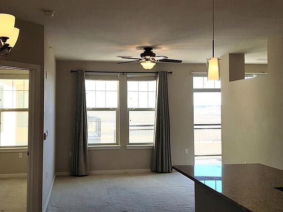 Panorama of Bedroom, living area, office area.