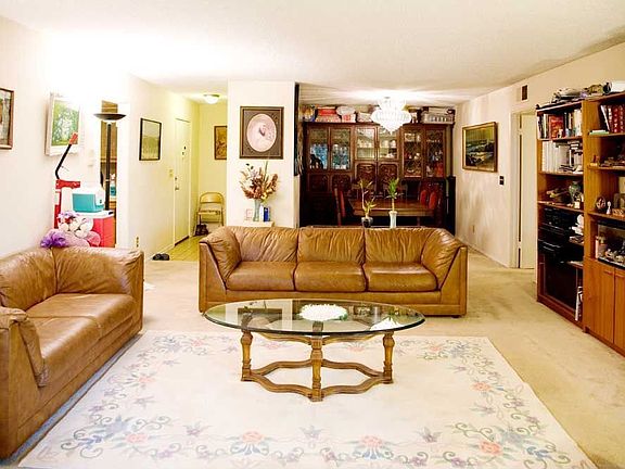 Large living room with entrance foyer, storage, patio and separate den.