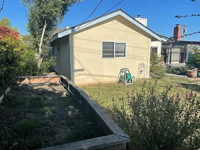 View of Master from back yard - raised garden area