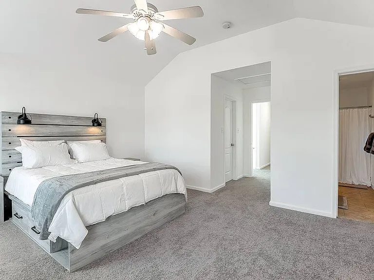Bedroom 1: Master bedroom with ensuite bathroom.