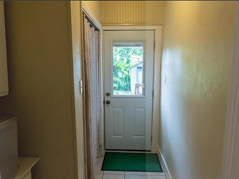 Hall with laundry and access to back yard