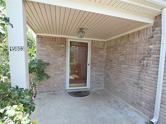 Covered front porch. Has a glass front door - plus a wood door.