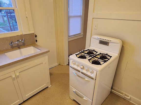 Kitchen with vintage stove, refrigerator not shown in this picture