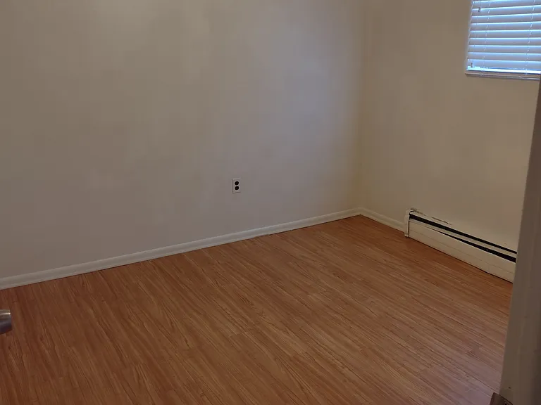 2nd Large Bedroom with a window and a closet