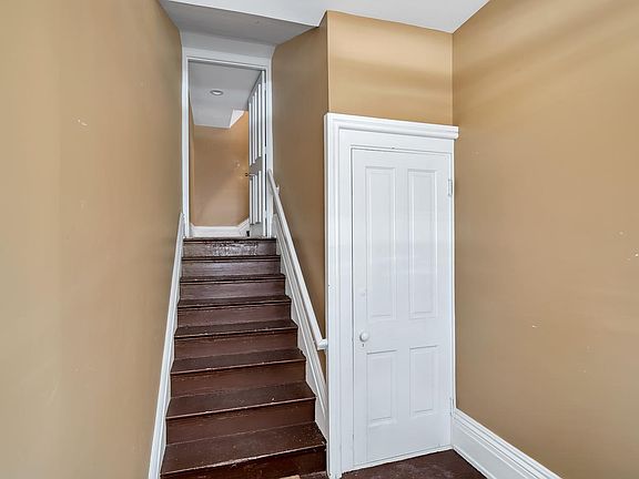 foyer and steps to basement