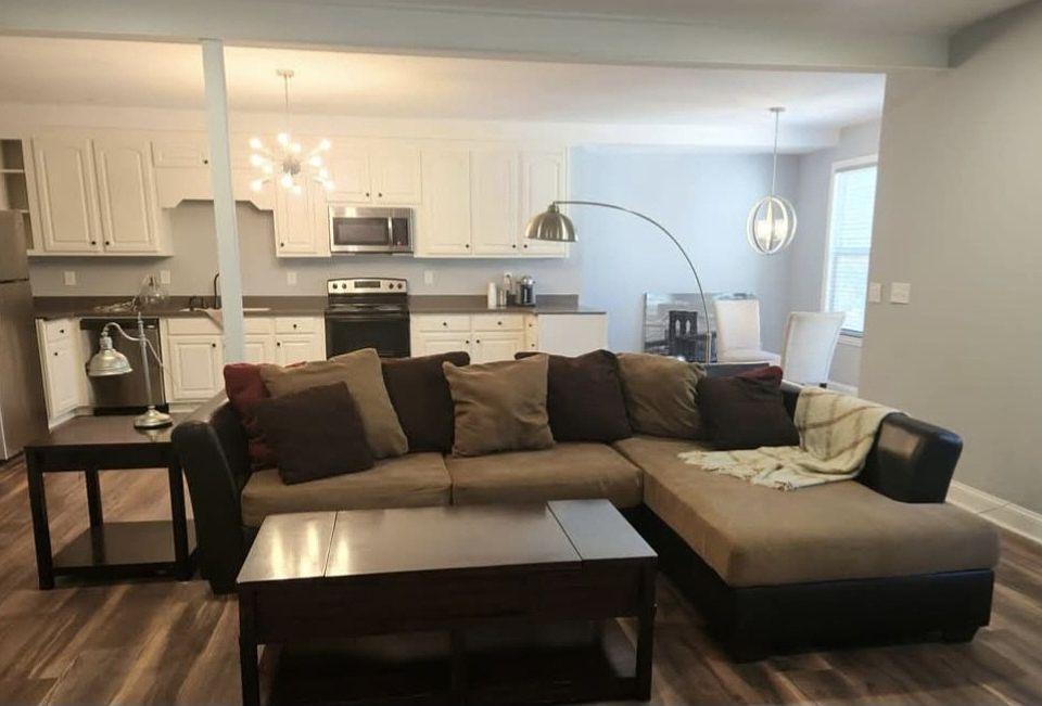 Partailly furnished living room and full size kitchen.