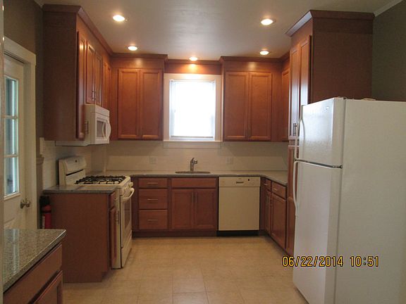 Modern, large kitchen with granite counter tops, new ceramic