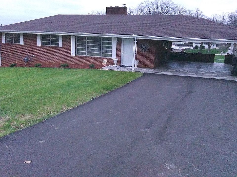 2 car carport. Paved drive.