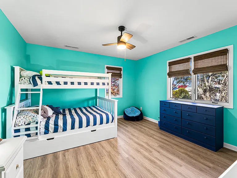 Large upstairs children's room with a bunk bed, separate TV, and plenty of space to sleep, play, and unwind.