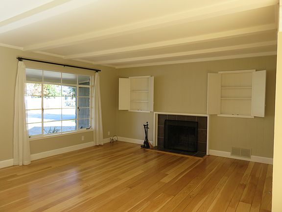 Living Room w/ wood-burning fire place