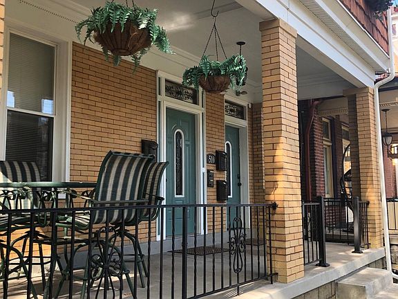 Front porch shared by all four apartments in the building