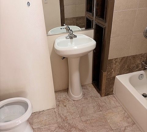 ONE OF TWO FULL BATHS