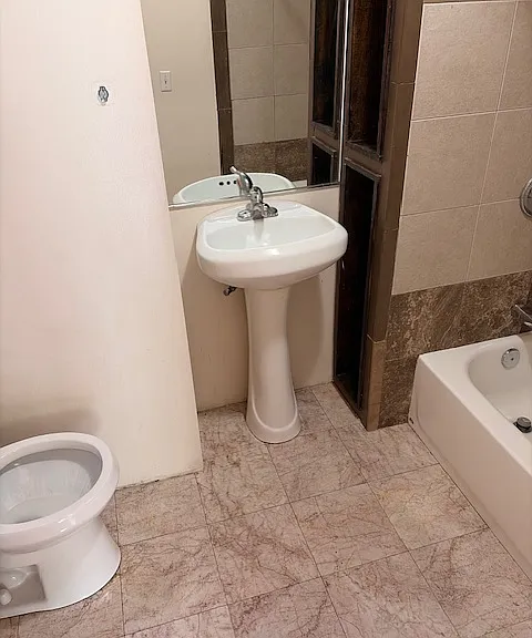 ONE OF TWO FULL BATHS