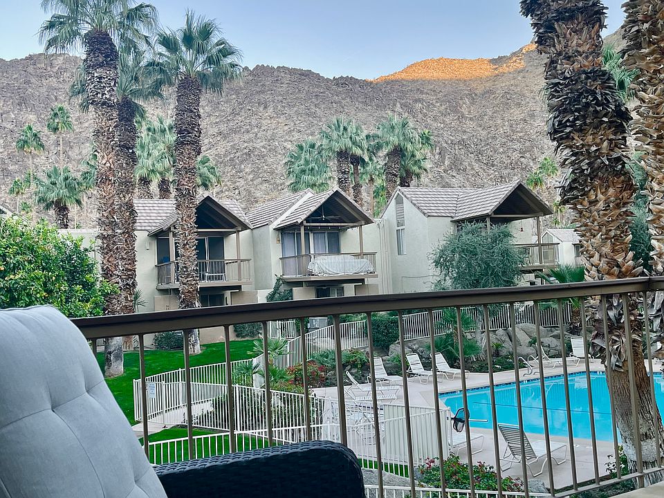 Surrounded by mountains, Patio has lovely view of mountain and pool.