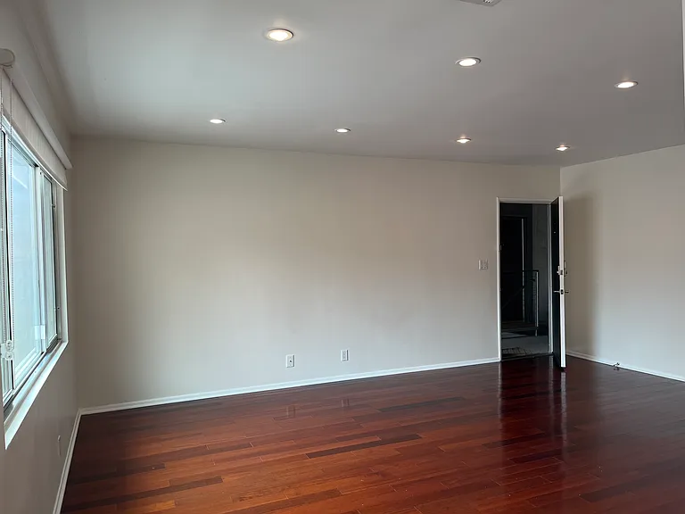 Living room area leading to the unit entrance