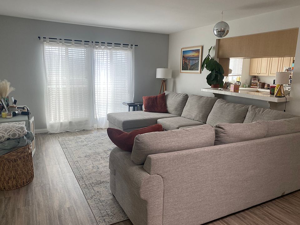 Living room with pass through and bar counter to the kitchen.