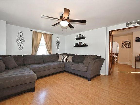 This large space with three windows can accommodate a huge sectional and entertainment center!