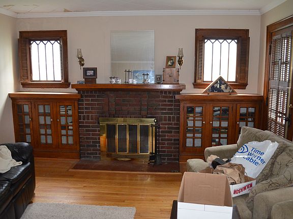 fireplace with built in bookshelves