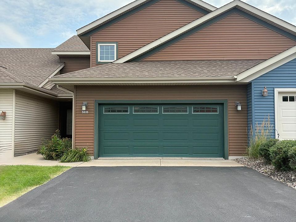 Front view of the condo showing the entry to the attached two car indoor garage.