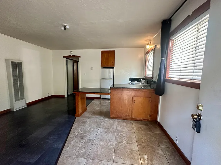 Nice, fresh open living space with new tile flooring throughout