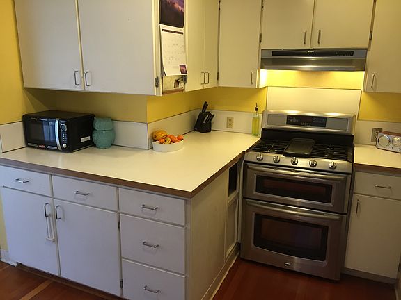 The kitchen opens out to the deck through a sliding glass do