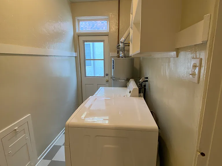 SEPARATE IN-UNIT LAUNDRY ROOM AND STORAGE CABINETS