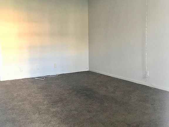 View of carpeted family room from front door