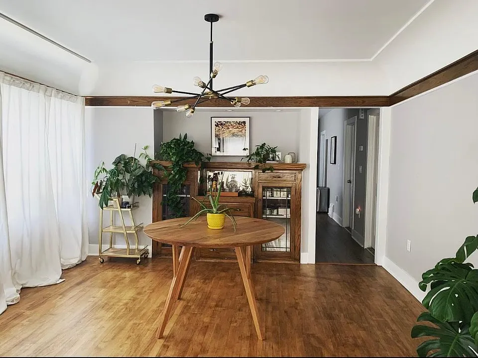 Dining room with built in hutch. Windows face driveway.