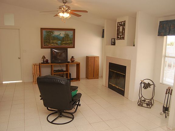 Family room with woodburning fireplace