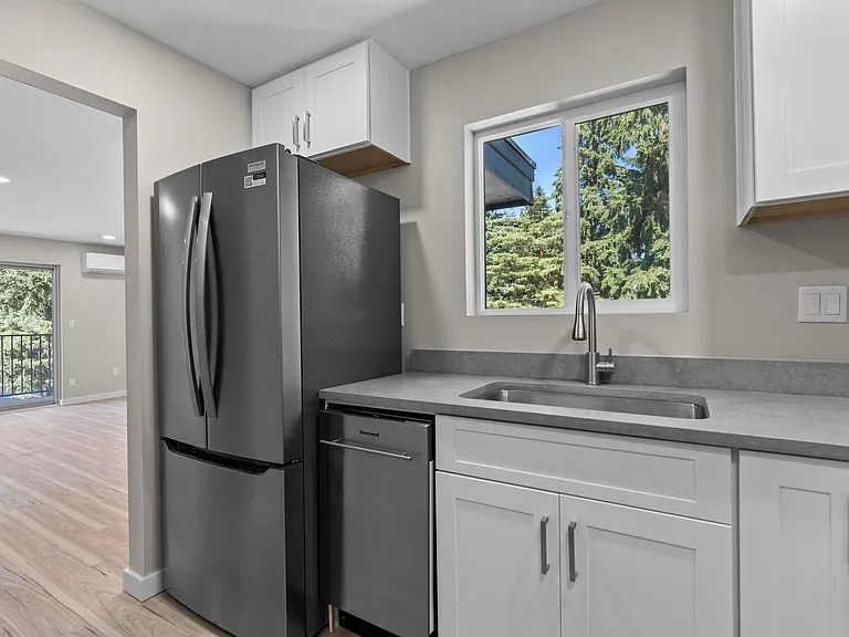 Kitchen with new stainless steel appliances and Quartz countertops