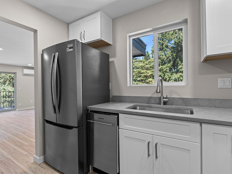 Kitchen with new stainless steel appliances and Quartz countertops